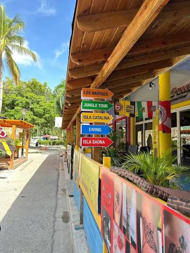Colorful directional sign for local excursions in Bayahibe Village
